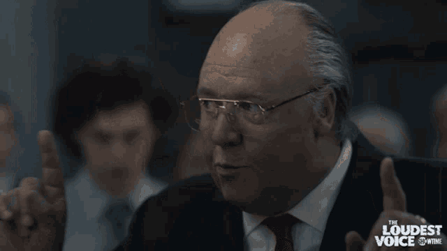 a man says we 're gonna win while wearing glasses and a suit