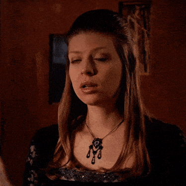 a woman with a necklace says fine thanks umm...
