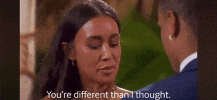 a man and a woman are smiling at each other and the woman is saying `` you 're different than i thought . ''
