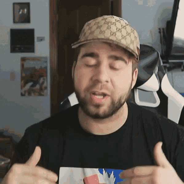 a man with a beard wears a gucci hat and a black shirt