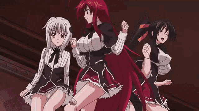 a group of three anime girls are dancing together in a dark room .