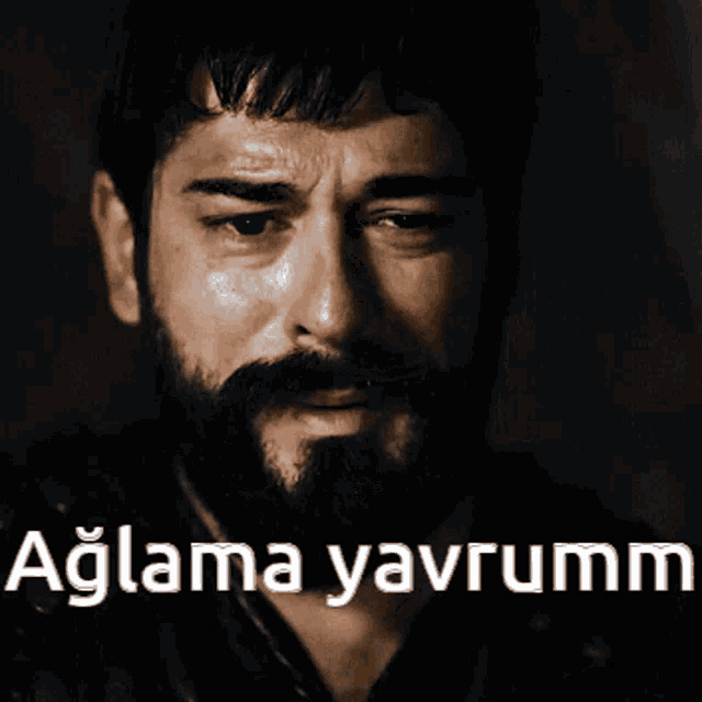 a man with a beard and the words aglama yavrumm on the bottom