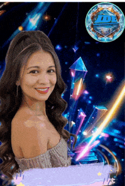 a woman in a silver dress is smiling in front of a display of crystals and a logo for db