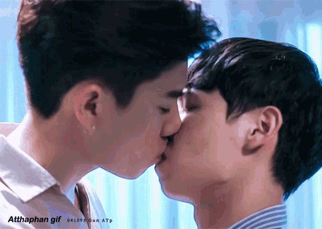 a gif of two men kissing has the hashtag atthaphan gif