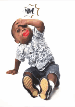 a baby with red lips and a wow speech bubble