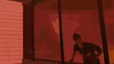 a man in a white tank top is walking down a street in a video game called flyingkitty