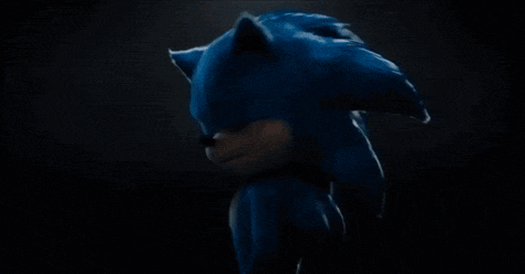 a close up of sonic the hedgehog 's face with his hands outstretched