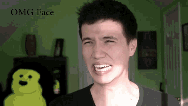 a man making a funny face with the words omg face below