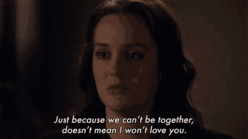 a woman is crying in a dark room with the words just because we can 't be together