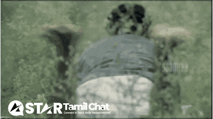 a blurred image of a person laying on the ground with a star tamil chat logo in the background