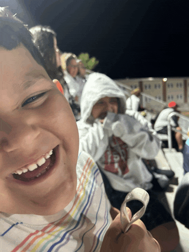 a boy wearing a shirt that says ' texas ' on it smiles for the camera