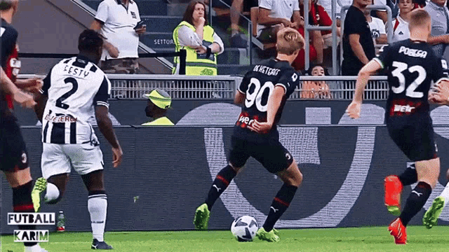 a soccer player with the number 90 on his back kicks a ball