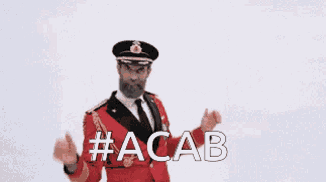 a man in a military uniform says #acab with his hands up