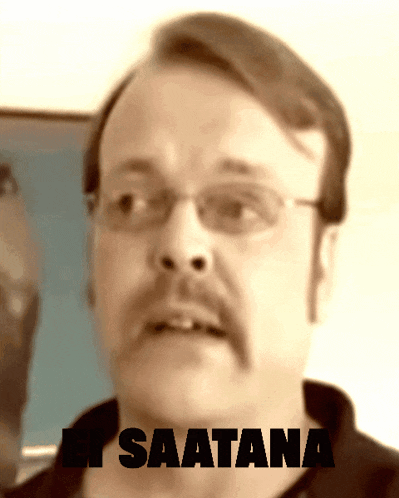 a man with glasses and a mustache says " saatana " in black letters