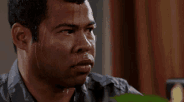 a man is sweating and looking at something