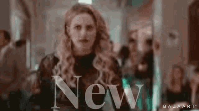 a blurry picture of a woman with the word new behind her