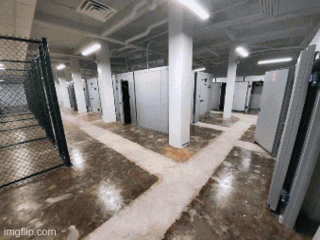 a room with a chain link fence and a watermark that says imgflip.com on the bottom