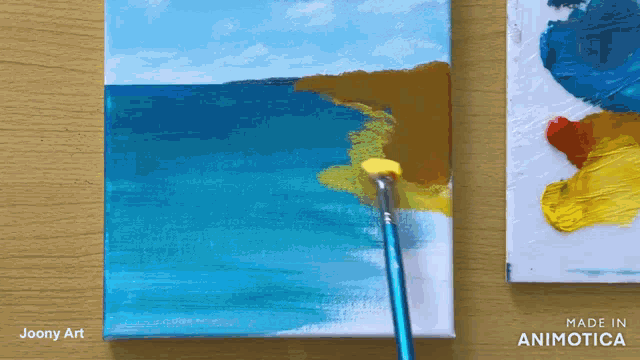 a painting of a beach is being painted by joony art