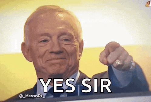 a man in a suit and tie is pointing at the camera with the words yes sir above him