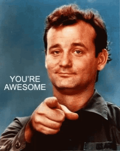a man pointing at the camera with the words you 're awesome on the bottom