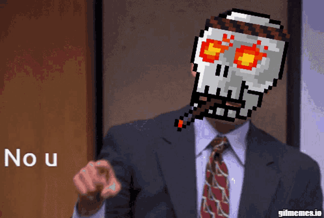 a man in a suit and tie with a pixelated skull on his face pointing