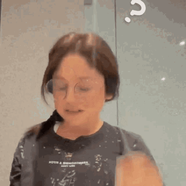 a girl wearing glasses and a t-shirt that says hotn & jacksons