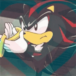 shadow the hedgehog from sonic the hedgehog is holding something in his hand .
