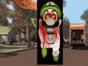 a picture of a cartoon character with a bloody face and a green hat .