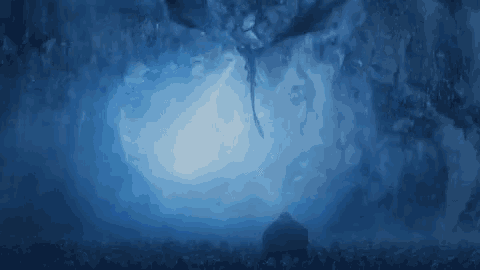 a dragon is flying over a crowd of people in a cave in the dark .