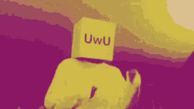 a person is holding a sign that says uwu on it .