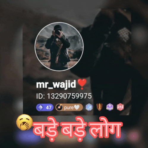 a picture of a man taking a picture with the name mr_wajid on it