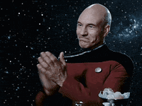 a man in a red uniform is clapping his hands