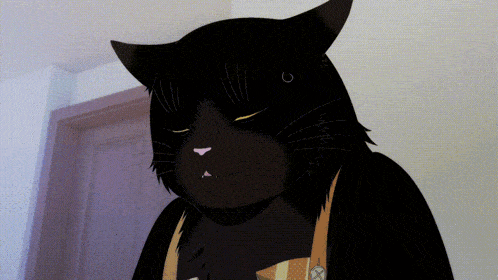 a black cat with a ring in its ear is wearing a yellow apron