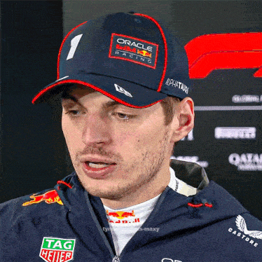 a man wearing a hat that has the number 1 on it
