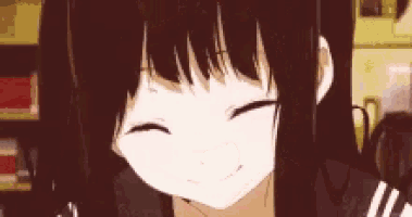 a close up of a girl with long hair smiling