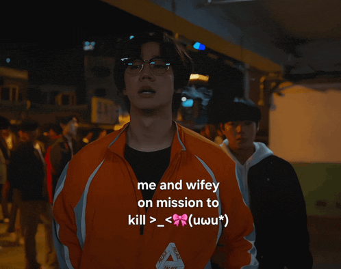 a man in an orange jacket with the words me and wifey on mission to kill