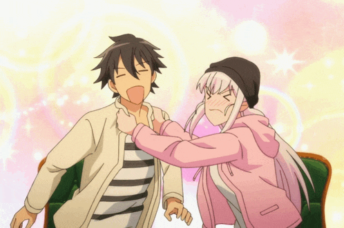 a girl in a pink jacket is hugging a boy