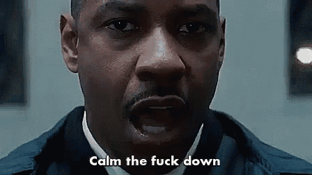 a close up of a man 's face with the words `` calm the fuck down '' written next to him .
