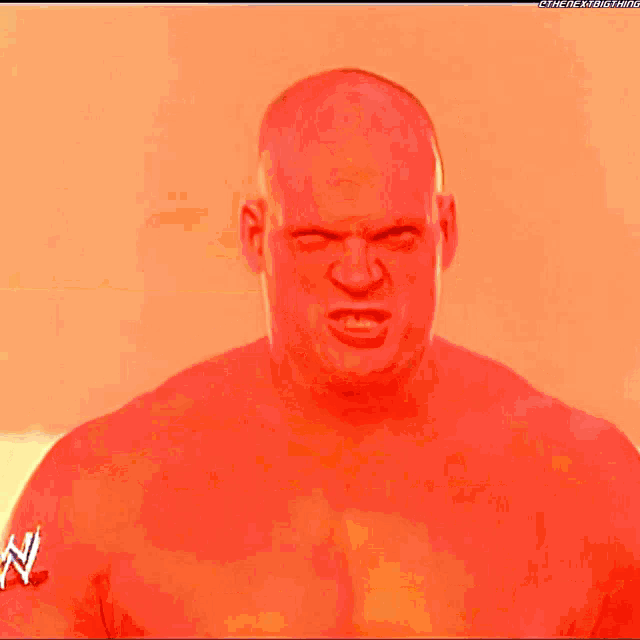 a bald man with kane written on a blue item