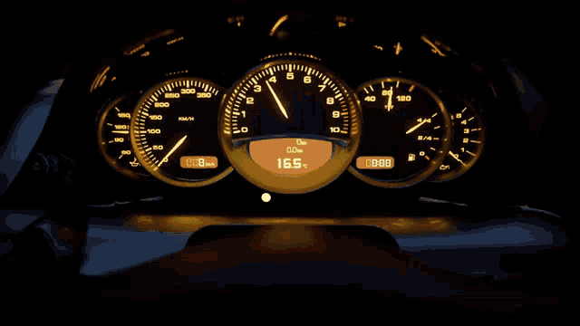 a close up of a car dashboard with a digital display showing a speed of 16.5 km / h