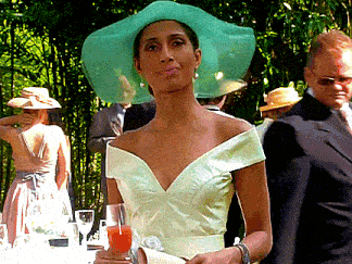 a woman wearing a green hat and a white dress