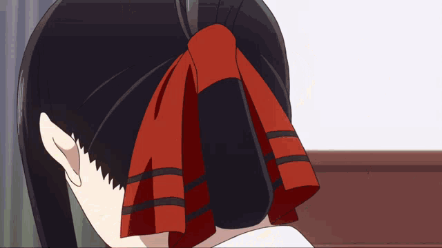 a girl with a red ribbon in her hair