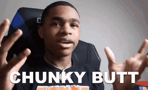 a young man sitting in a chair with the words chunky butt behind him