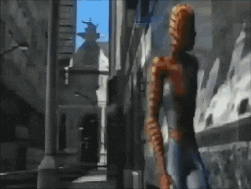 a person is standing in front of a wall that is on fire .