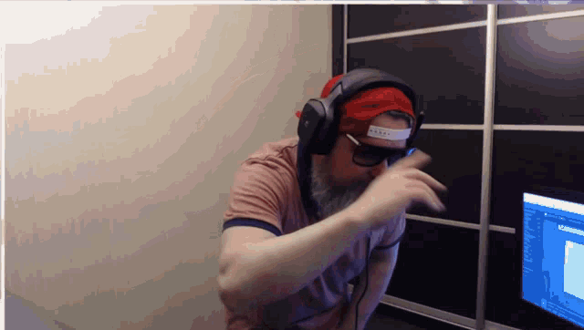 a man wearing headphones and a hat that says ' armani '