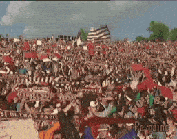 a crowd of people in a stadium with the word ultras on a scarf