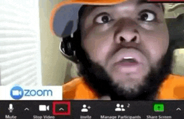 a man with a beard is making a funny face while having a video call .
