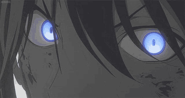 a close up of a person 's eyes with glowing blue eyes .