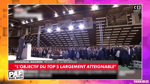 emmanuel macron is giving a speech at a convention
