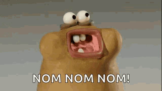 a cartoon character with its mouth open and the words nom nom nom below it